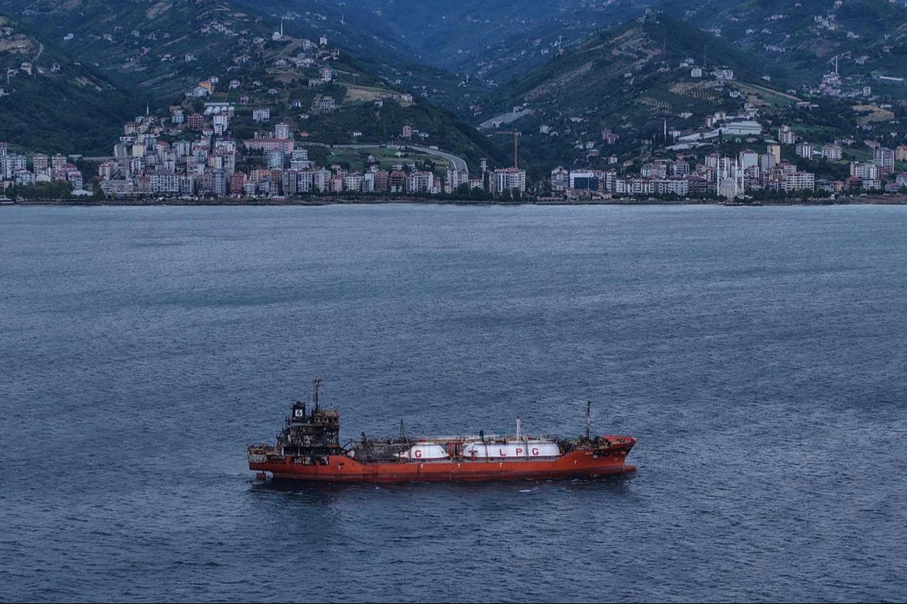 Following the escalation of drone attacks targeting commercial vessels in the Black Sea, another civilian merchant ship that was hit has anchored off the coast of Trabzon, Türkiye, July 27, 2026. (IHA Photo)