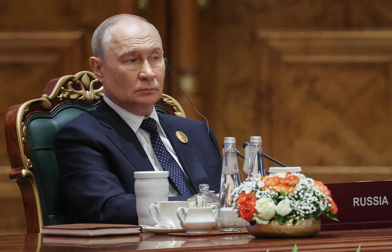 In this pool photograph distributed by the Russian state agency Sputnik, Russia's President Vladimir Putin attends the 18th BRICS Summit in New Delhi on September 12, 2026. (Photo by Sputnik / AFP)