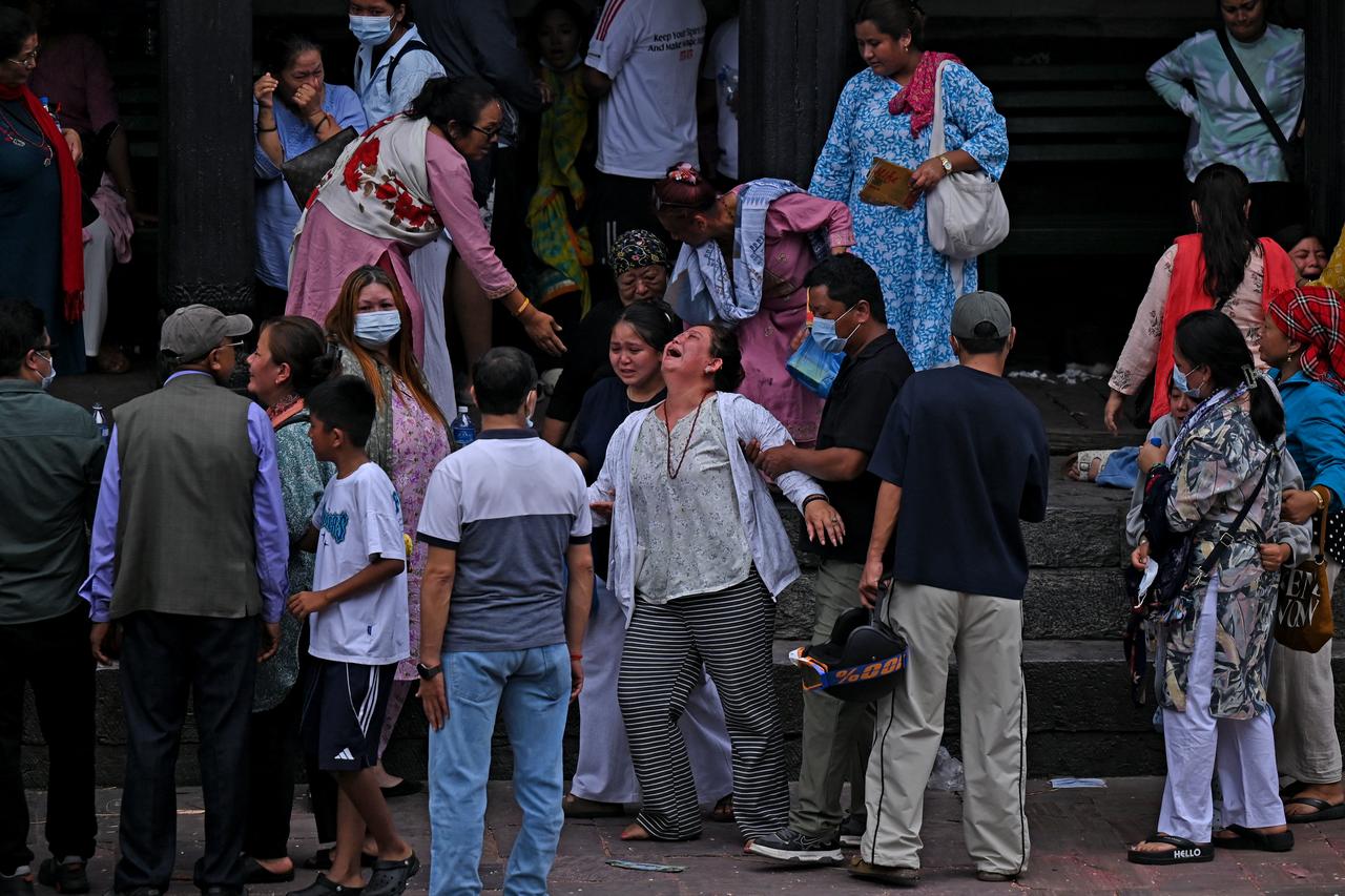 Relatives and residents grieve following deadly flooding in Nepal, Sept. 2, 2026. (AFP Photo)