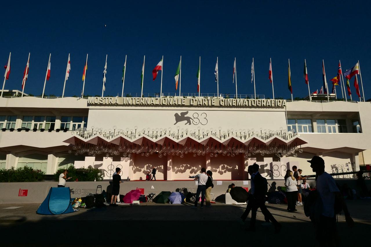 Visitors and media gather outside the main venue of the 83rd Venice International Film Festival on the Lido in Venice, Italy, Sept. 2, 2026. (AFP Photo)
