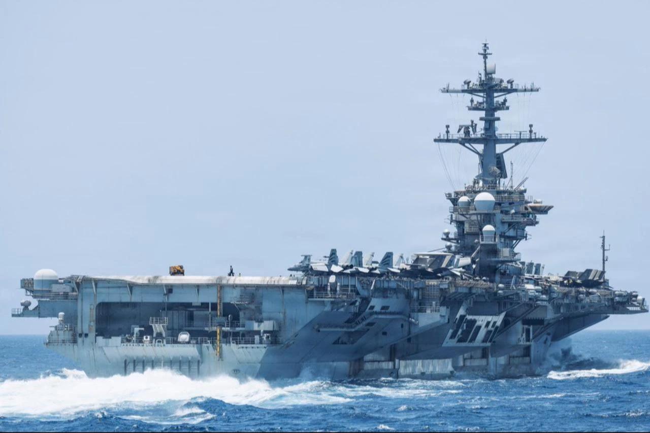 USS Abraham Lincoln (CVN-72) sails through the Arabian Sea while supporting U.S. military operations in the region, date and time undisclosed. (Photo via X/@CENTCOM)