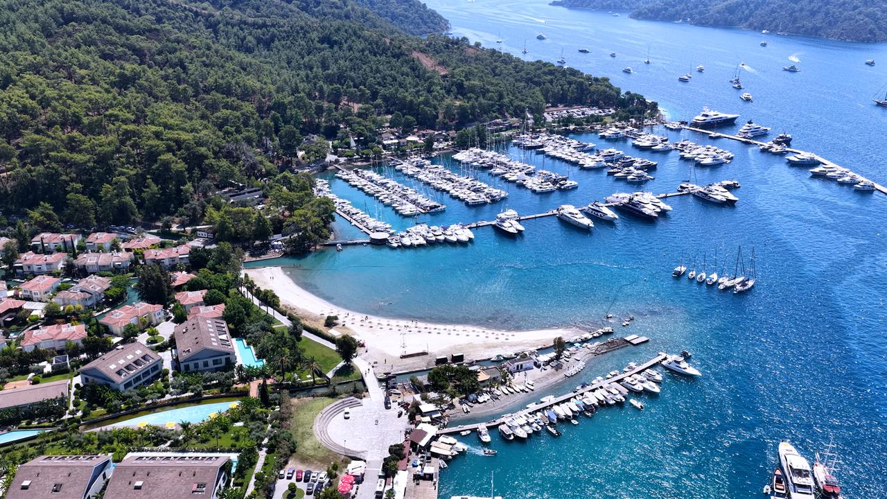 An aerial view shows Gocek Public Beach, marinas and the surrounding coastal settlement in Fethiye, Mugla, Türkiye, Sept. 20, 2026. (AA Photo)