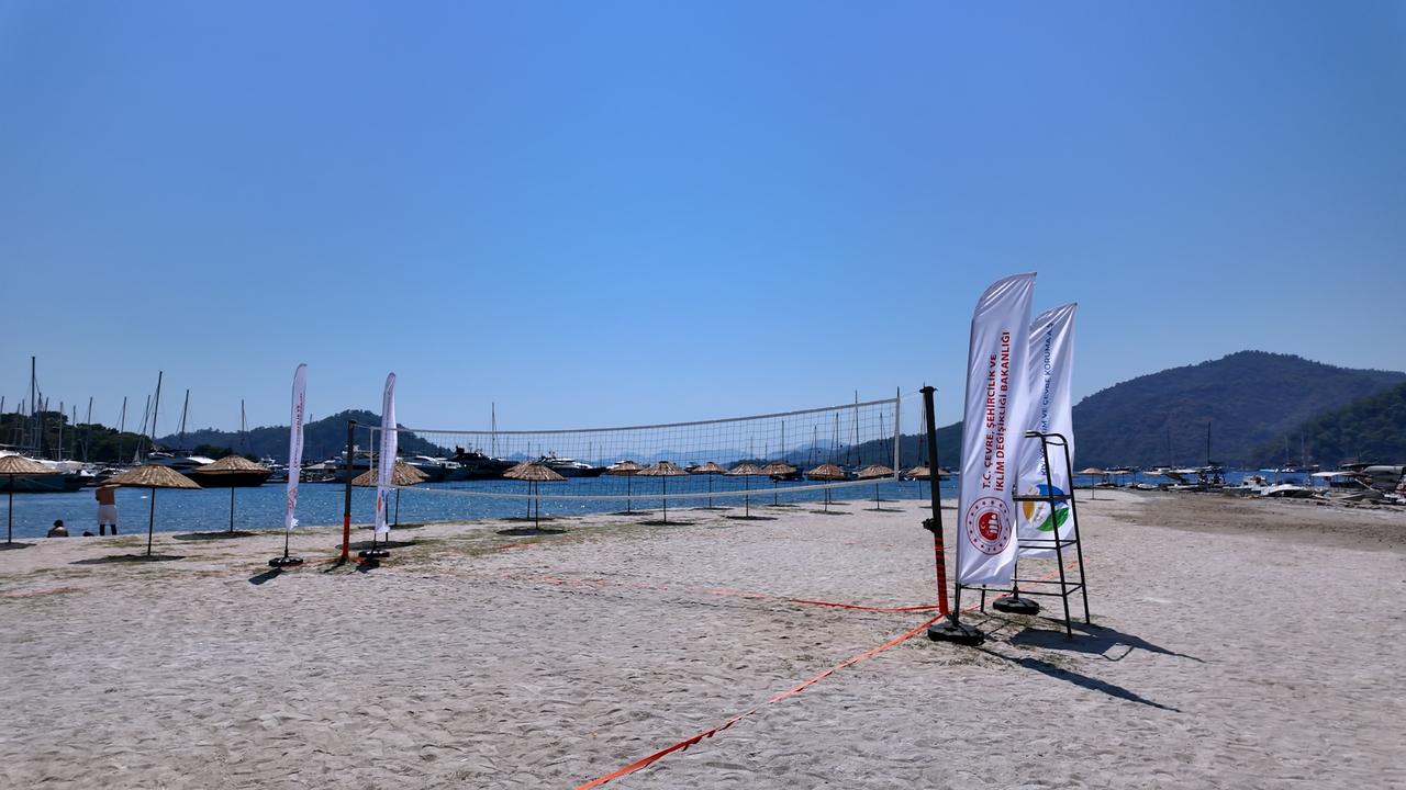 A beach volleyball court and facilities are seen at Gocek Public Beach in Fethiye, Mugla, Türkiye, Sept. 20, 2026. (AA Photo)