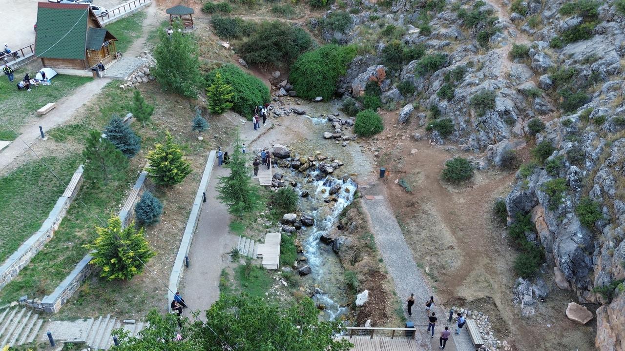 An aerial view shows the natural springs and surrounding landscape near the Ivriz Rock Monument in Halkapinar, Konya, Türkiye. (IHA Photo)