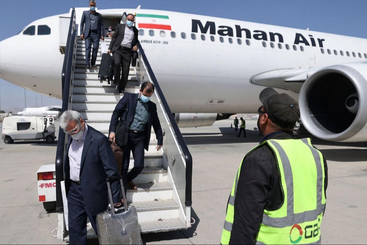 Passengers get off from a privately owned Iranian airline Mahan Air flight at the airport in Kabul on September 15, 2021. (AFP Photo)