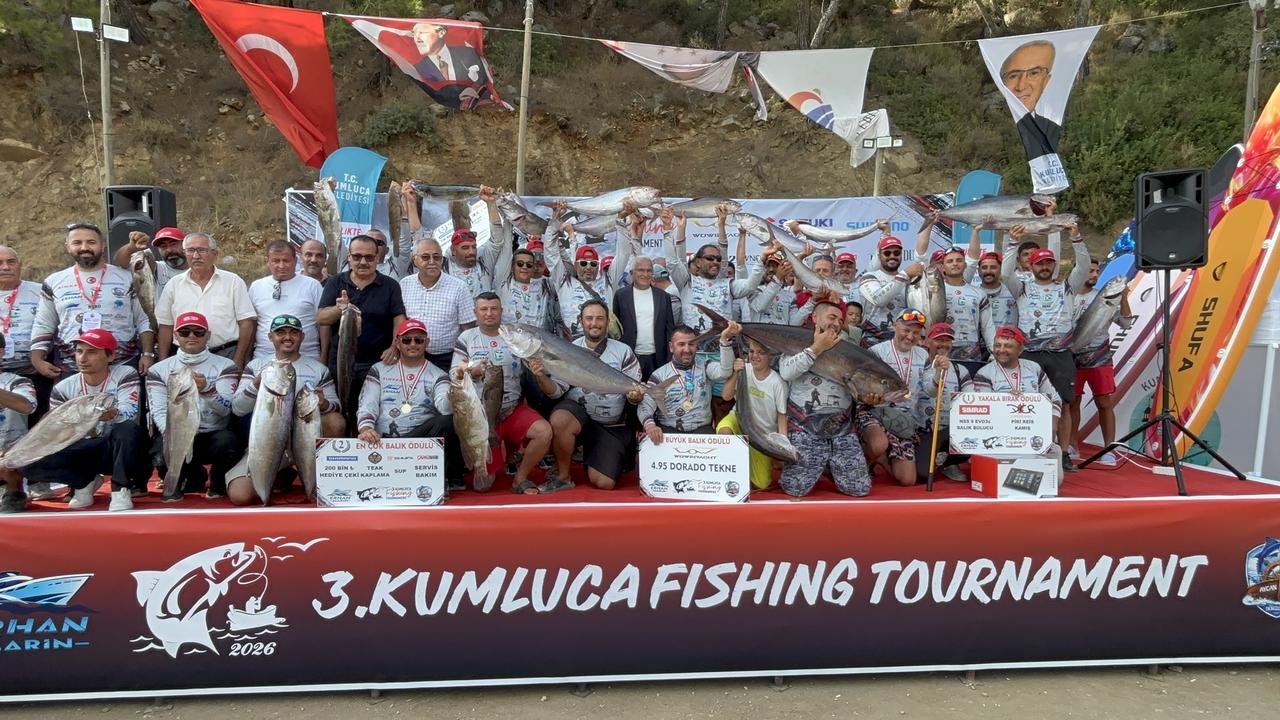 Participants and officials pose with their catches after the 3rd Kumluca Fishing Tournament in Kumluca, Antalya, Türkiye, Sept. 20, 2026. (AA Photo)