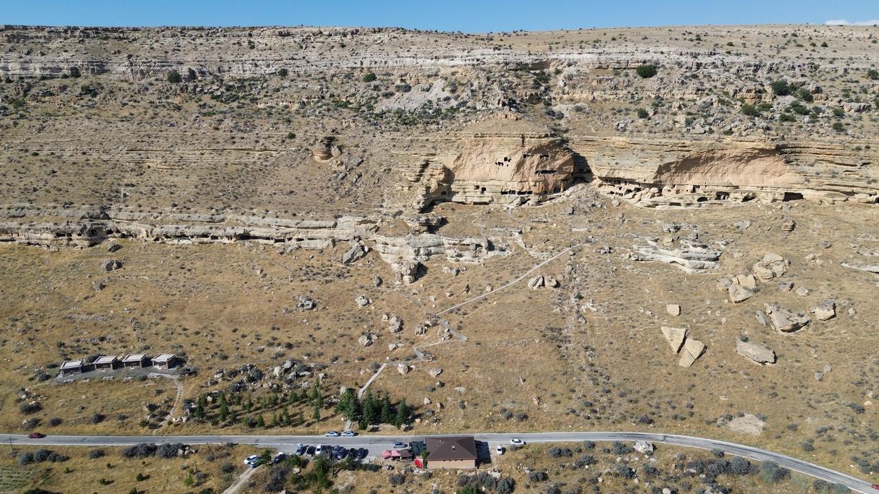 Visitors explore the five-level Manazan Caves, carved by hand into a massive rock formation in Taskale village, Karaman, Türkiye. (IHA Photo)