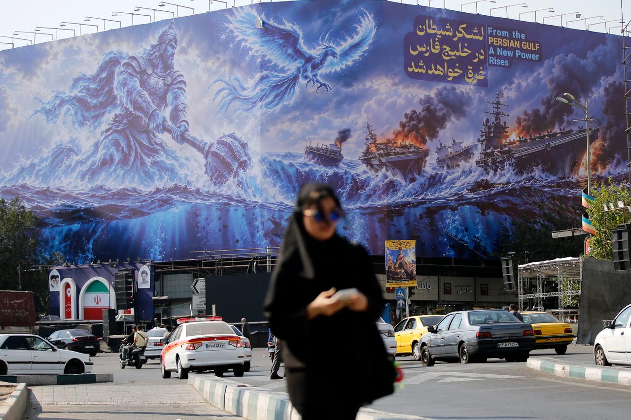 A huge anti-American billboard reading in Persian "The army of Satan will drown in the Persian Gulf" is unveiled at Enqelab Square amid heightened tensions between Iran and the United States as daily life continues in Tehran, Iran, on September 13, 2026. (AA Photo)