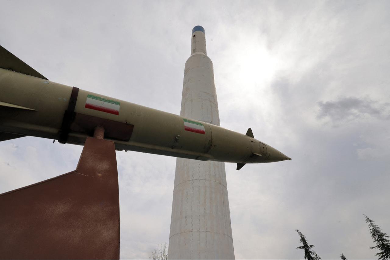 Mockups of domestically made Iranian missiles are displayed at an exhibition outside the Defense Museum in Tehran on March 31, 2026. (AFP Photo)
