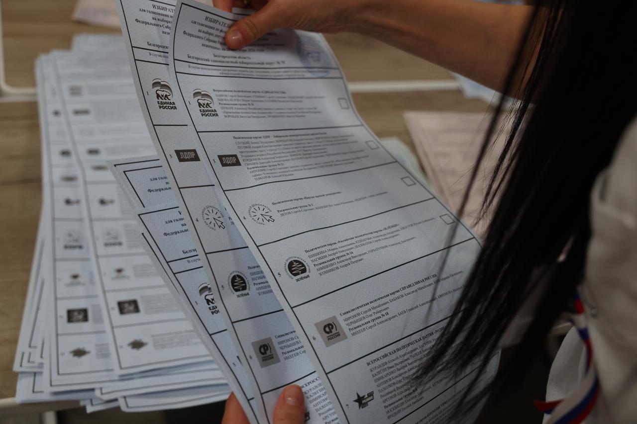 A member of an electoral commission examines a ballot as votes are counted after polls close on the final day of elections to Russia's ninth State Duma and governor of the Belgorod Region at a polling station in Belgorod, Russia, on September 20, 2026. (AA Photo)