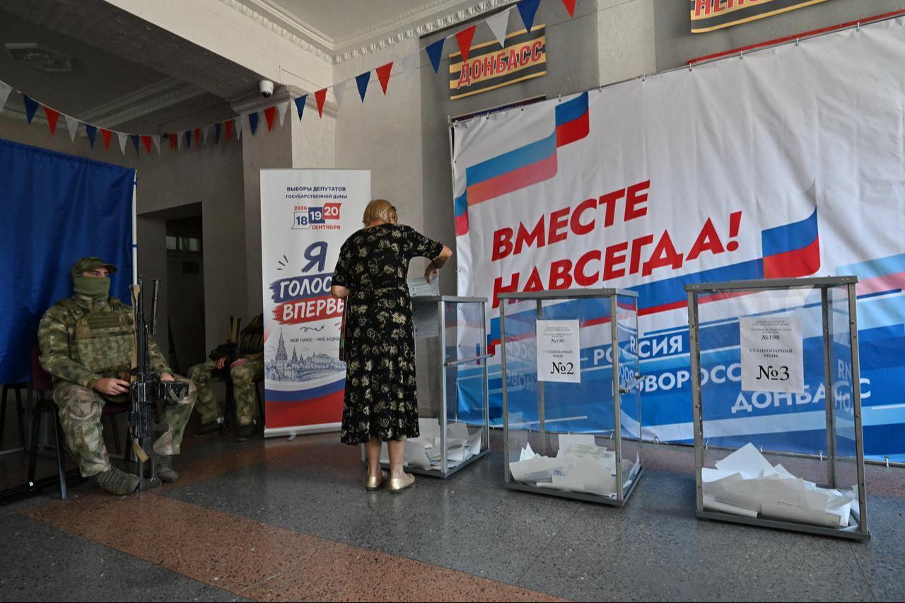 A woman casts her ballot for Russia's parliamentary election at a polling station in Donetsk, Russian-controlled Ukraine, on September 20, 2026. (AFP Photo)