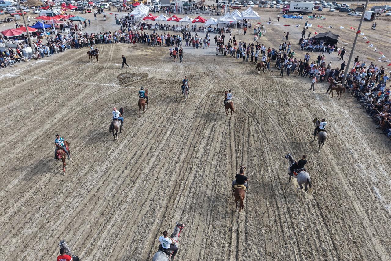 Riders compete as spectators watch a traditional cirit event in Manisa, Türkiye, Sept. 20, 2026. (AA Photo)