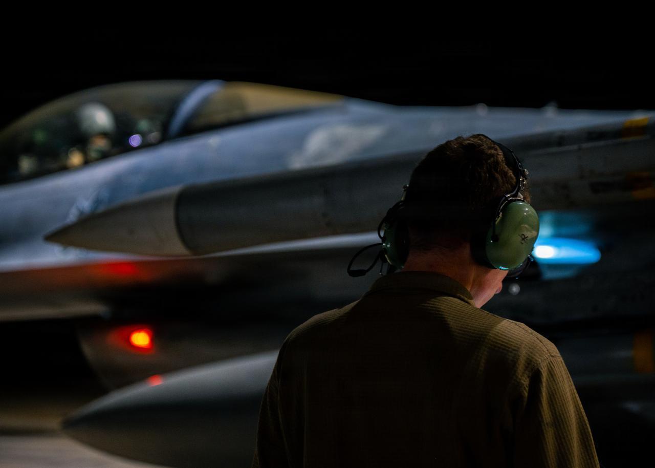 A U.S. Air Force weapons load crew chief conducts preflight checks on a U.S. Air Force F-16 Fighting Falcon aircraft at a base in the U.S. Central Command area of responsibility Aug. 31, 2026. (Photo via U.S. Air Force)