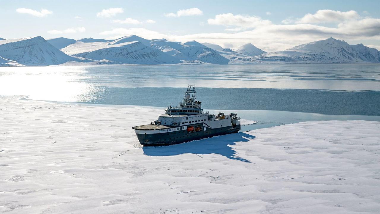 The icebreaker scientific research vessel Kronprins Haakon sails through a fjord covered with sea ice in eastern Spitzbergen on April 6, 2025. (AFP Photo)