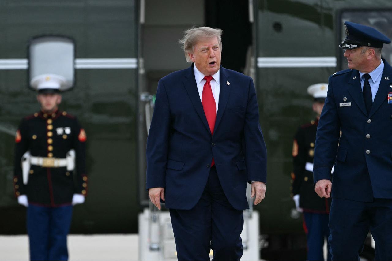 US President Donald Trump exits Marine One to board Air Force One at Joint Base Andrews, Maryland on September 21, 2026. (AFP Photo)
