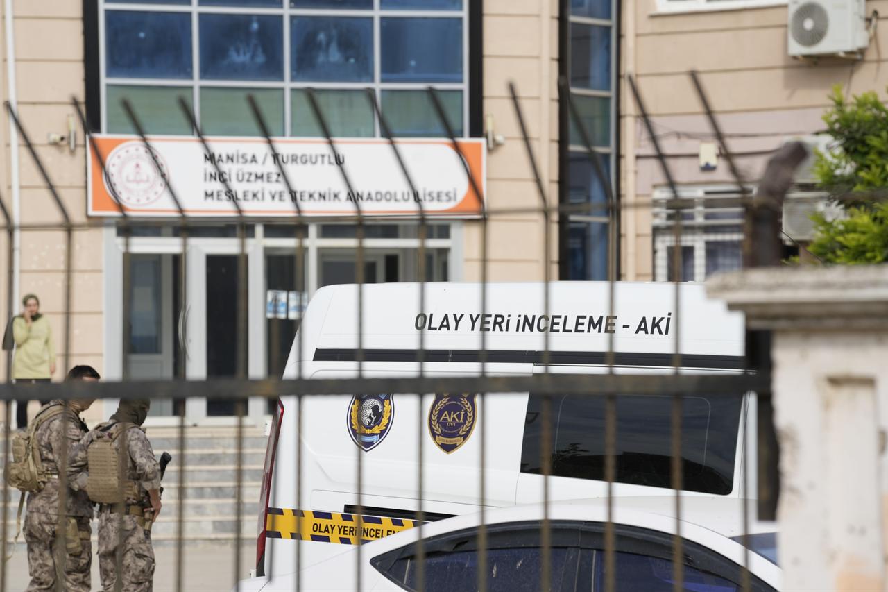 Police forensic teams work outside Inci Uzmez Vocational and Technical Anatolian High School in Turgutlu, Manisa, western Türkiye, following the attack. (IHA Photo)