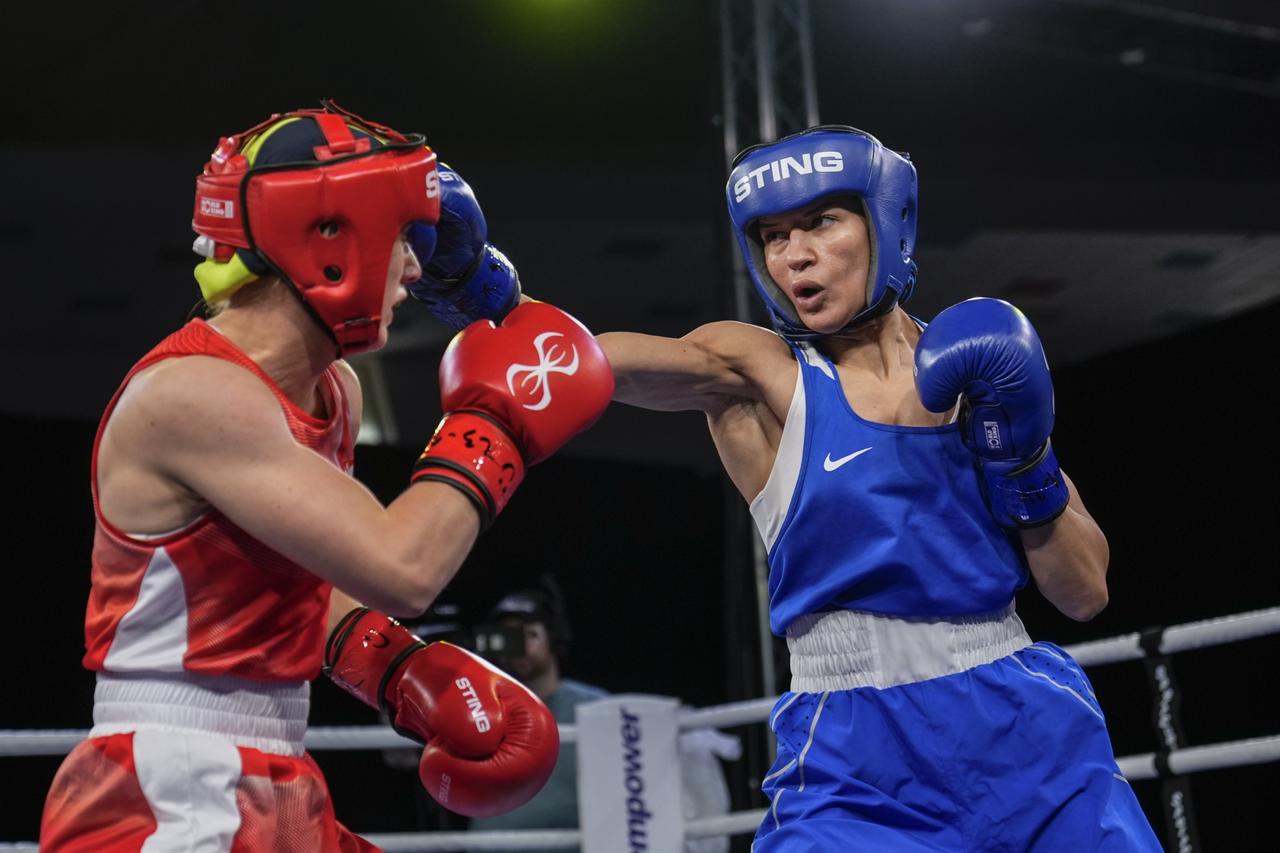 Turkish boxer Hatice Akbas (blue) competes against Natalia Kuczewska (red) of Poland during their women's 51kg bout at the 2026 European Boxing Championships held at Asics Arena in Sofia, Bulgaria on Sept.r 23, 2026.  (AA Photo)
