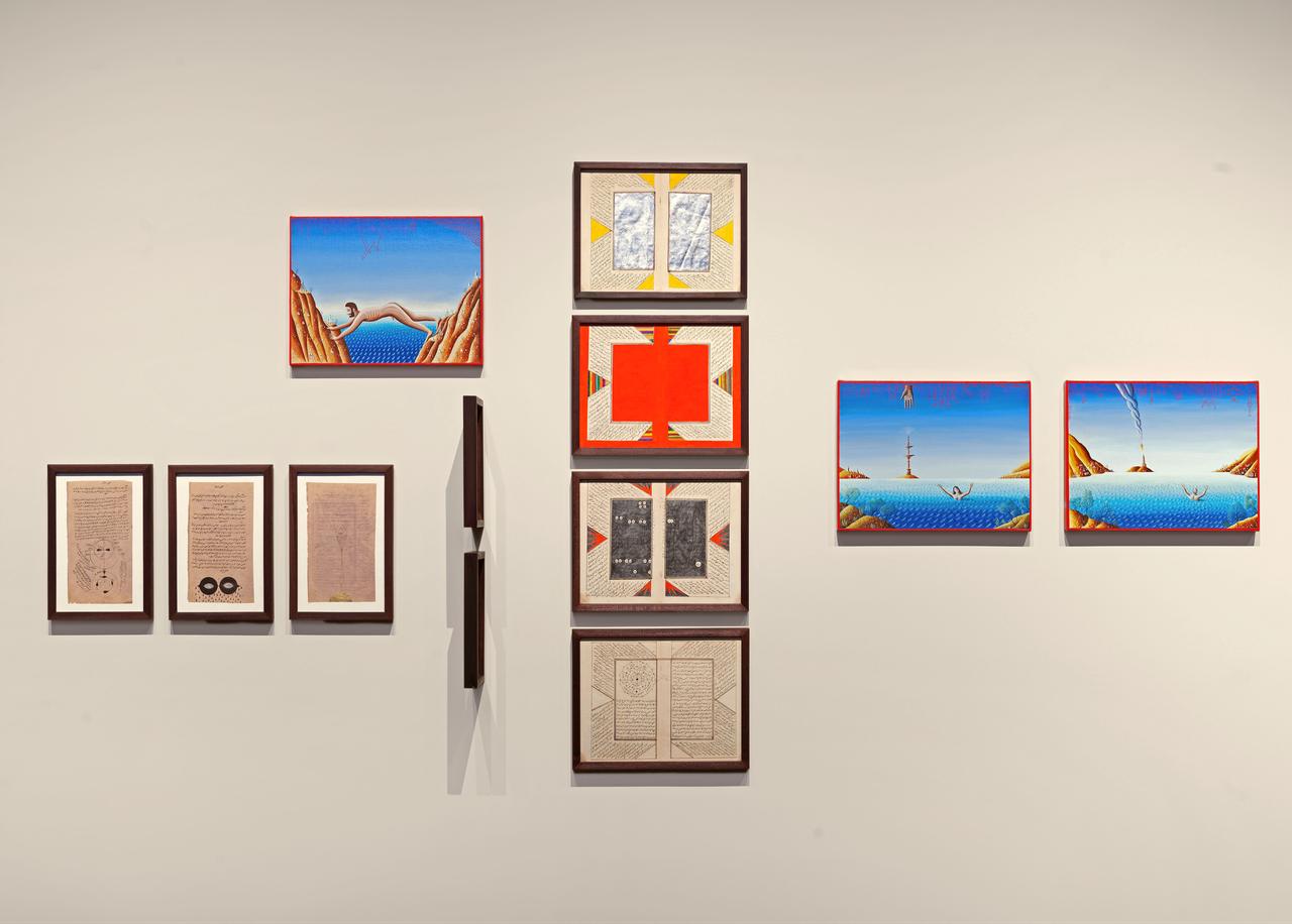 An installation view of "Atlas of Encounters," featuring paintings, manuscripts and other works displayed inside the Byzantine Cistern of Zeyrek Cinili Hamam in Istanbul, Türkiye. (AA Photo)