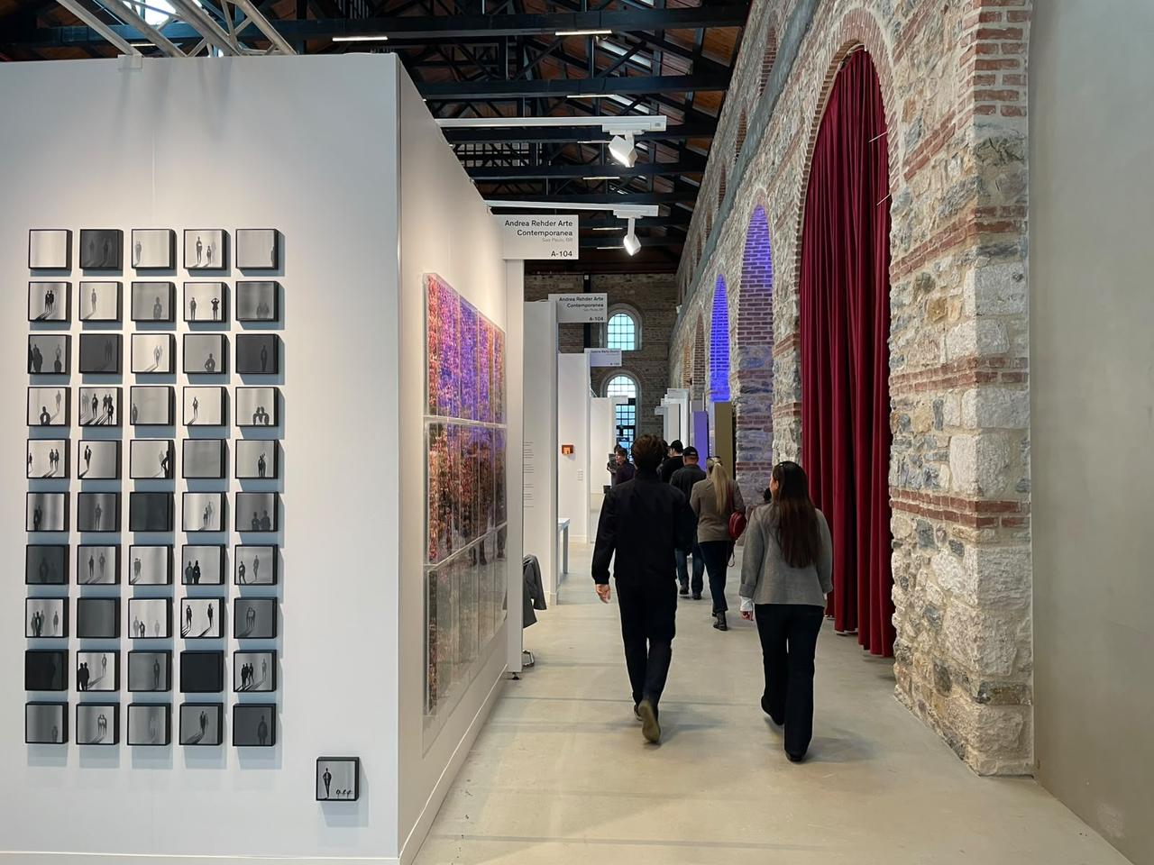 Visitors walk through gallery booths during the 21st edition of Contemporary Istanbul at Tersane Istanbul in Istanbul, Türkiye, Sept. 23, 2026. (Photo by Koray Erdogan/Türkiye Today