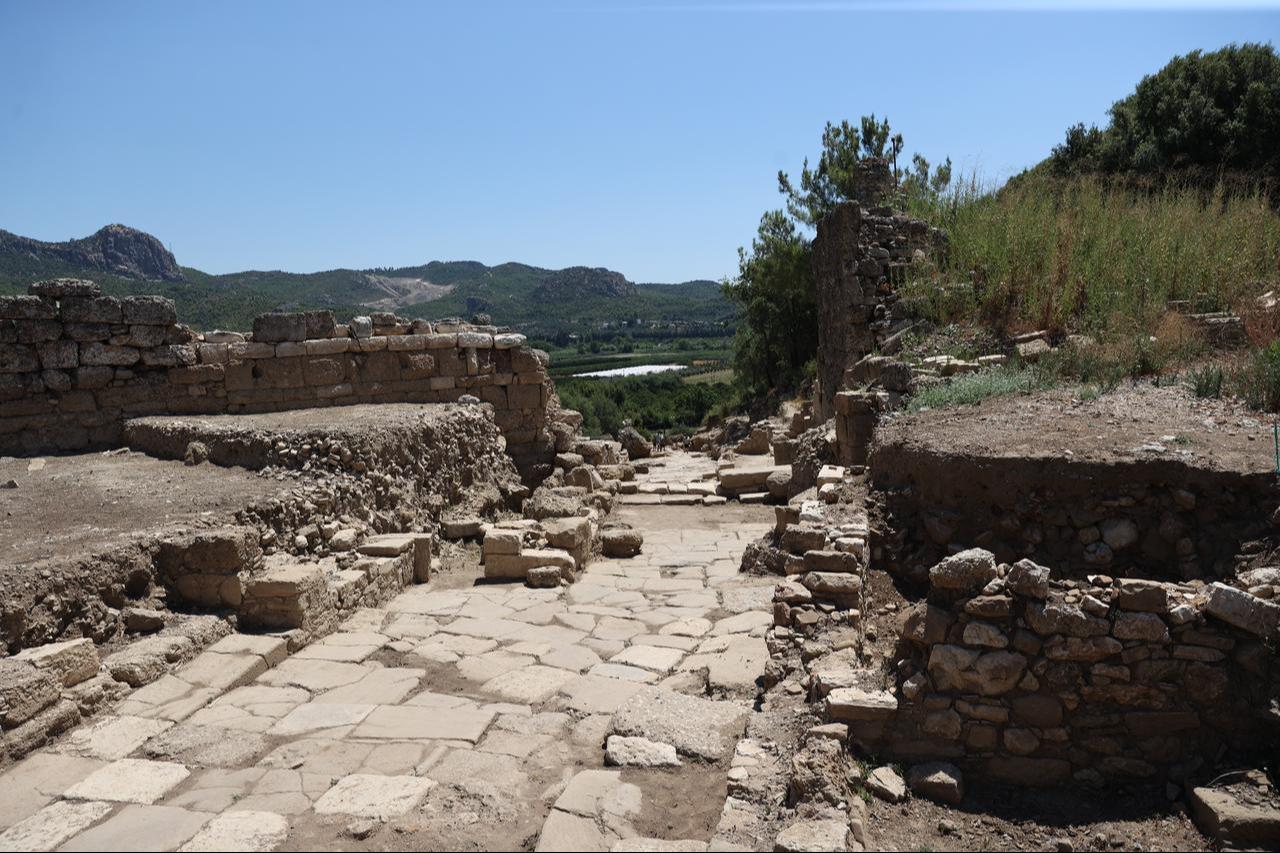 The restored stone-paved main street of the ancient city of Aspendos is seen in Antalya, Türkiye, July 21, 2026. (AA Photo)