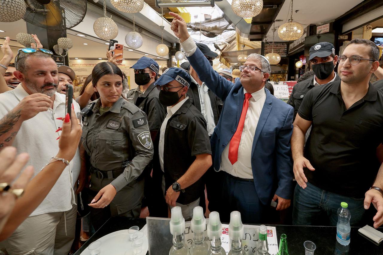 Israel's far-right National Security Minister and chairman of the Otzma Yehudit party Itamar Ben Gvir (C) tours the HaTikva Market during a meet-and-greet as part of his campaign in the coastal city of Tel Aviv, Sept. 18, 2026. (AFP Photo)