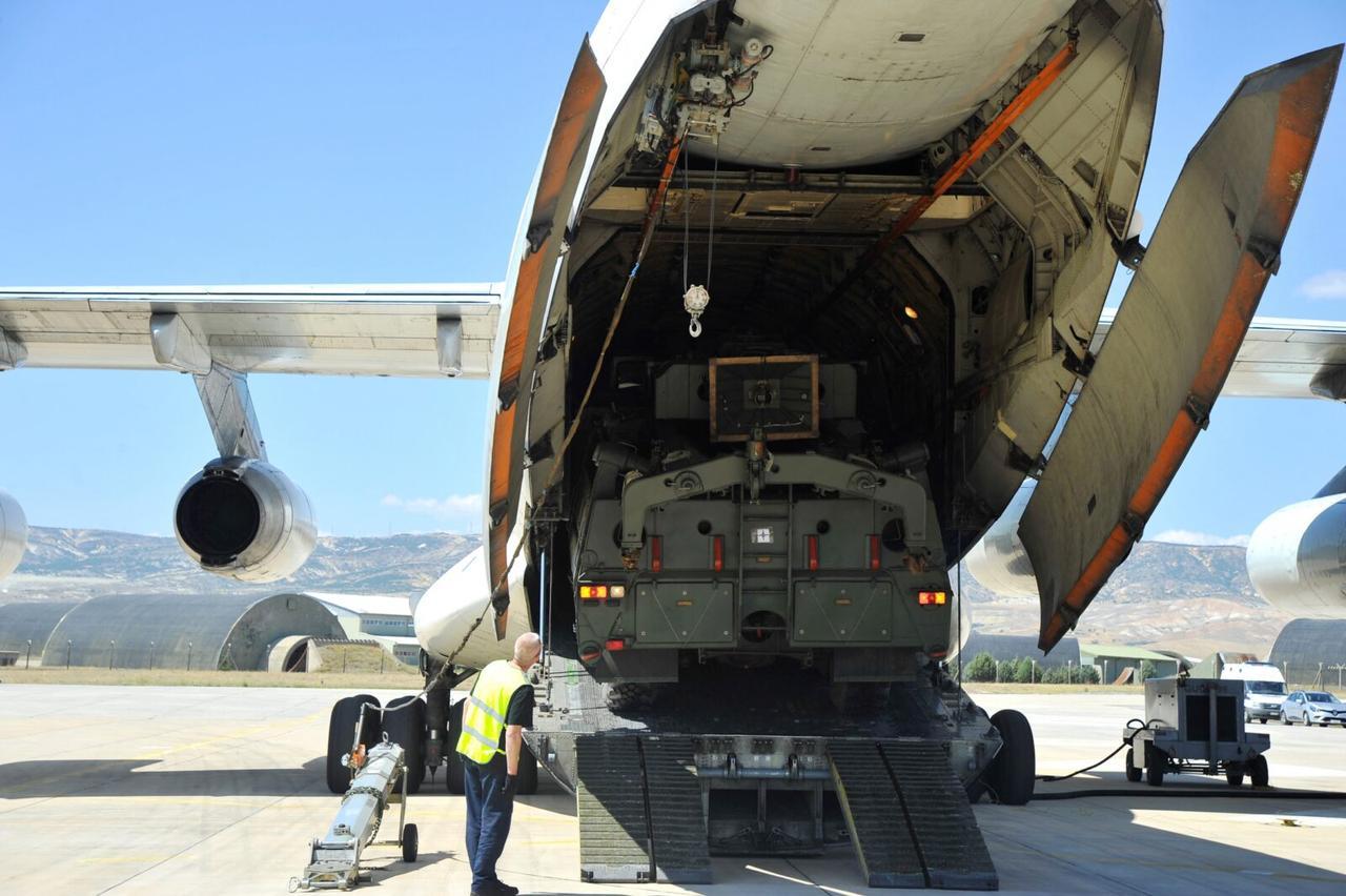 Parts of a Russian S-400 missile defense system are unloaded from a Russian plane at Murted Airport, known as Akinci Air Base, near Ankara, July 12, 2019. (HO/Turkish Defense Ministry)