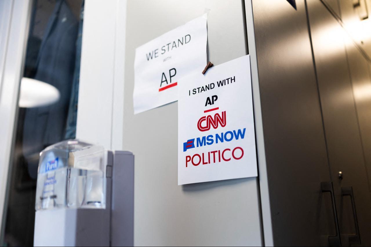 Signs of support for AP, CNN, MS NOW and POLITICO hang on the White House grounds on September 21, 2026 in Washington, DC. (AFP Photo)