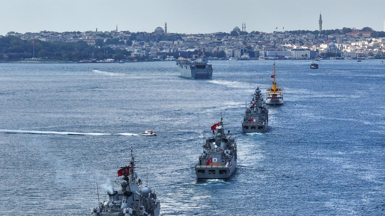 Turkish Navy vessels sail in formation through the Istanbul Strait during a ceremonial passage marking August 30 Victory Day and Turkish Armed Forces Day, on Aug. 30, 2026 in Istanbul, Türkiye. (AA Photo)