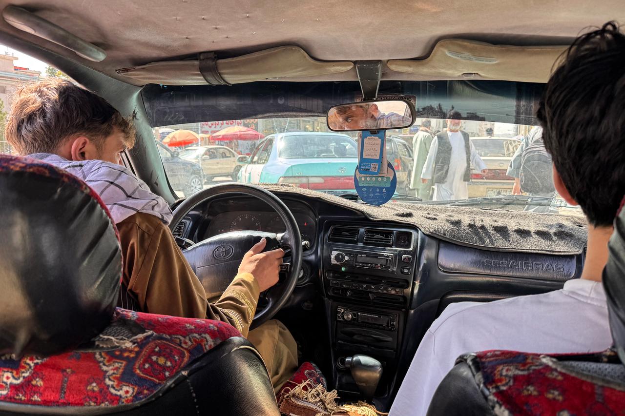 This photograph, taken on September 10, 2026, shows a car's music system as an Afghan taxi driver transports passengers in Kabul. (AFP Photo)