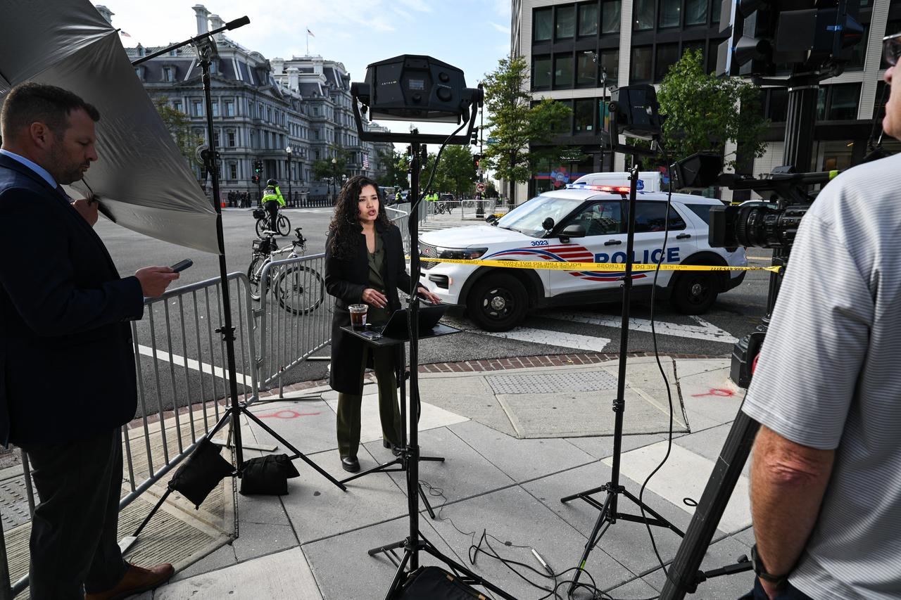 MS Now White House Correspondent Laura Barron-Lopez works on a street corner near the White House in Washington, DC, on September 24, 2026. (AFP Photo)