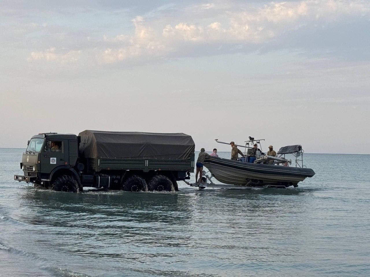 Rescue divers return to shore following search and rescue operations for 17 Kazakh servicemen who were swept into the Caspian Sea by strong winds during a military exercise in Kazakhstan on September 24, 2026. (Kazakh Ministry of Defense/AA Photo)