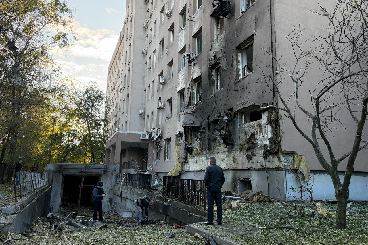 Ukrainian law enforcement officers work next to a damaged medical center following an air attack in Zaporizhzhia on September 25, 2026, amid the Russian invasion of Ukraine. (AFP Photo)