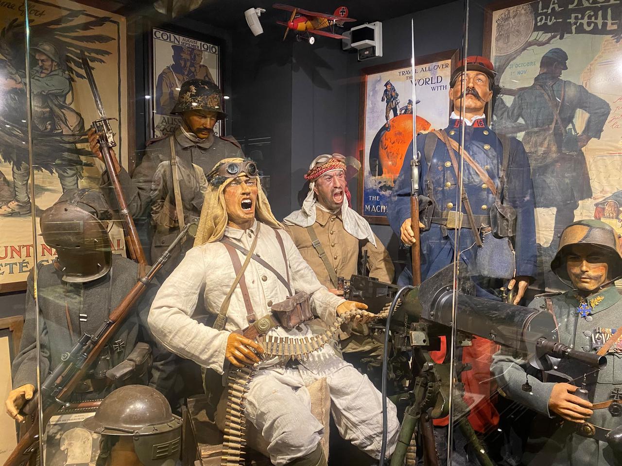 World War I soldiers against a backdrop of historic propaganda posters; it’s a detailed diorama from the Hisart Museum representing multi-national frontline combatants, including Ottoman, German, and Allied forces operating heavy weaponry. (Photo via Türkiye Today team/Feiza Jdidi)