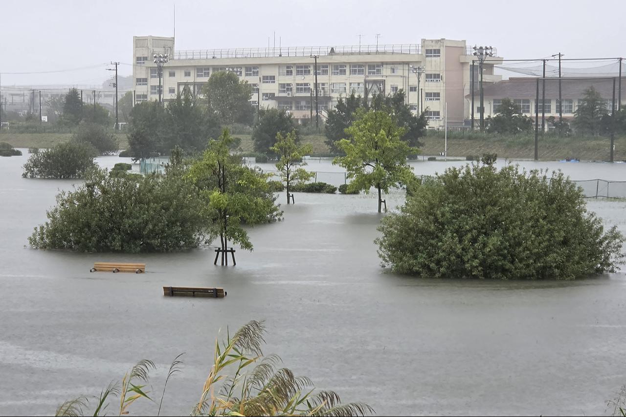 Flooding inundates a park as heavy rain falls amid weather patterns due to Typhoon Dujuan in Ichikawa city, Chiba Prefecture on September 21, 2026.(AFP Photo)