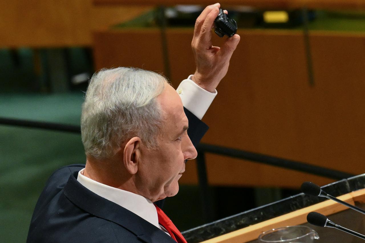 Israel's Prime Minister Benjamin Netanyahu holds up a pager as he speaks during the 81st United Nations General Assembly at the United Nations Headquarters in New York, on September 24, 2026. (AFP Photo)