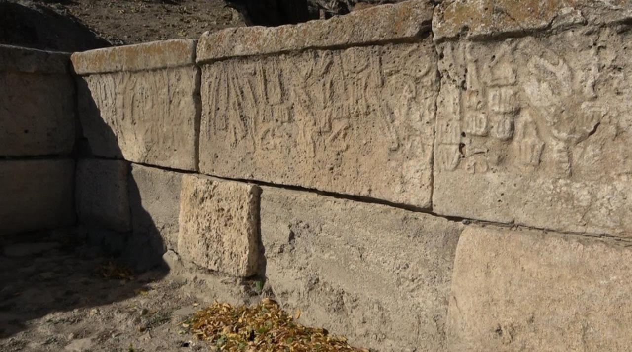 Ancient Hittite hieroglyphs remain visible on the stone walls of the Yalburt Water Monument, dated to around 1250-1260 B.C. (IHA Photo)