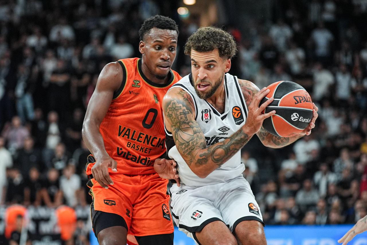 Scottie Wilbekin (12) of Besiktas competes against T. J. Shorts (0) of Valencia Basket during the EuroLeague Regular Season Round 1 match between Besiktas and Valencia Basket at the Turkcell Basketball Development Center in Istanbul, Türkiye, on September 25, 2026. (AA Photo)