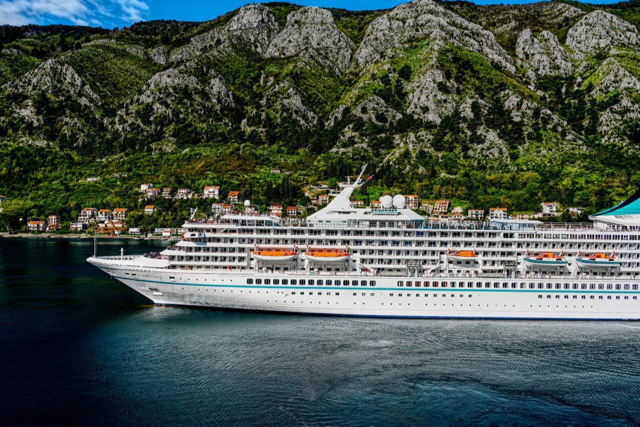 Large cruise ship sailing through the spectacular Bay of Kotor near Perast, Montenegro, on an unspecified date. (Adobe Stock Photo)