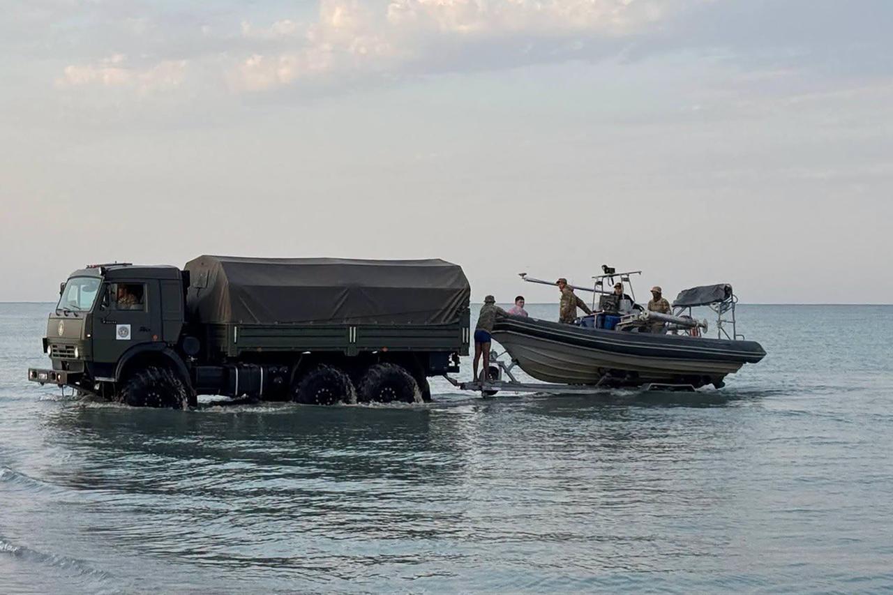 In this undated handout photograph released by the Kazakh Defence Ministry on September 25, 2026, Kazakh military personnel conduct search and rescue operations at an undisclosed location in the waters of the Caspian Sea. (Photo by Handout / Kazakh Defence Ministry / AFP)