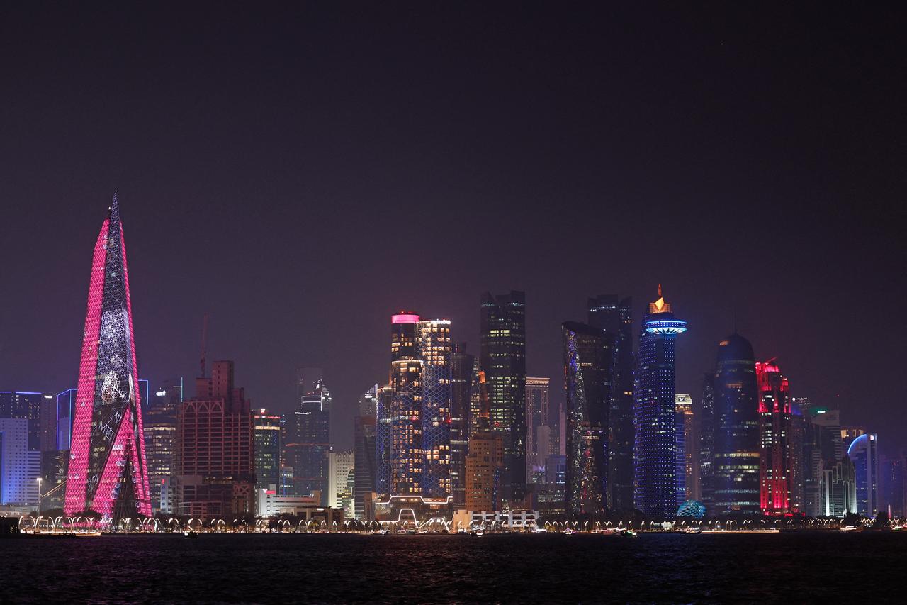 The skyline of illuminated high-rise buildings is seen along the Corniche Promenade in Doha on September 4, 2026. (AFP Photo)