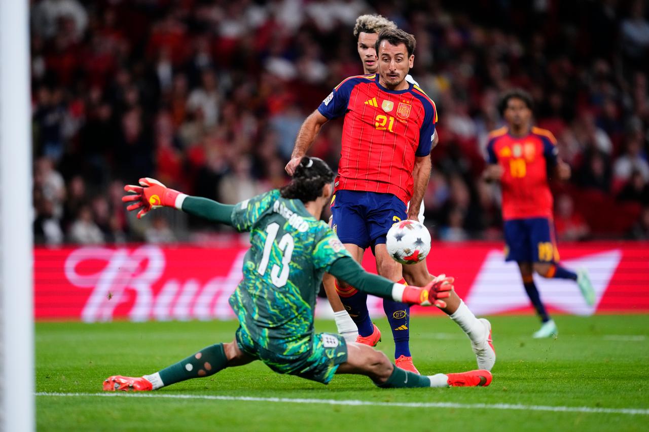 Spain's No. 21 shoots past England goalkeeper No. 13 during their UEFA Nations League Group A3 match at Wembley Stadium in London, Sept. 26, 2026. (AA Photo)
