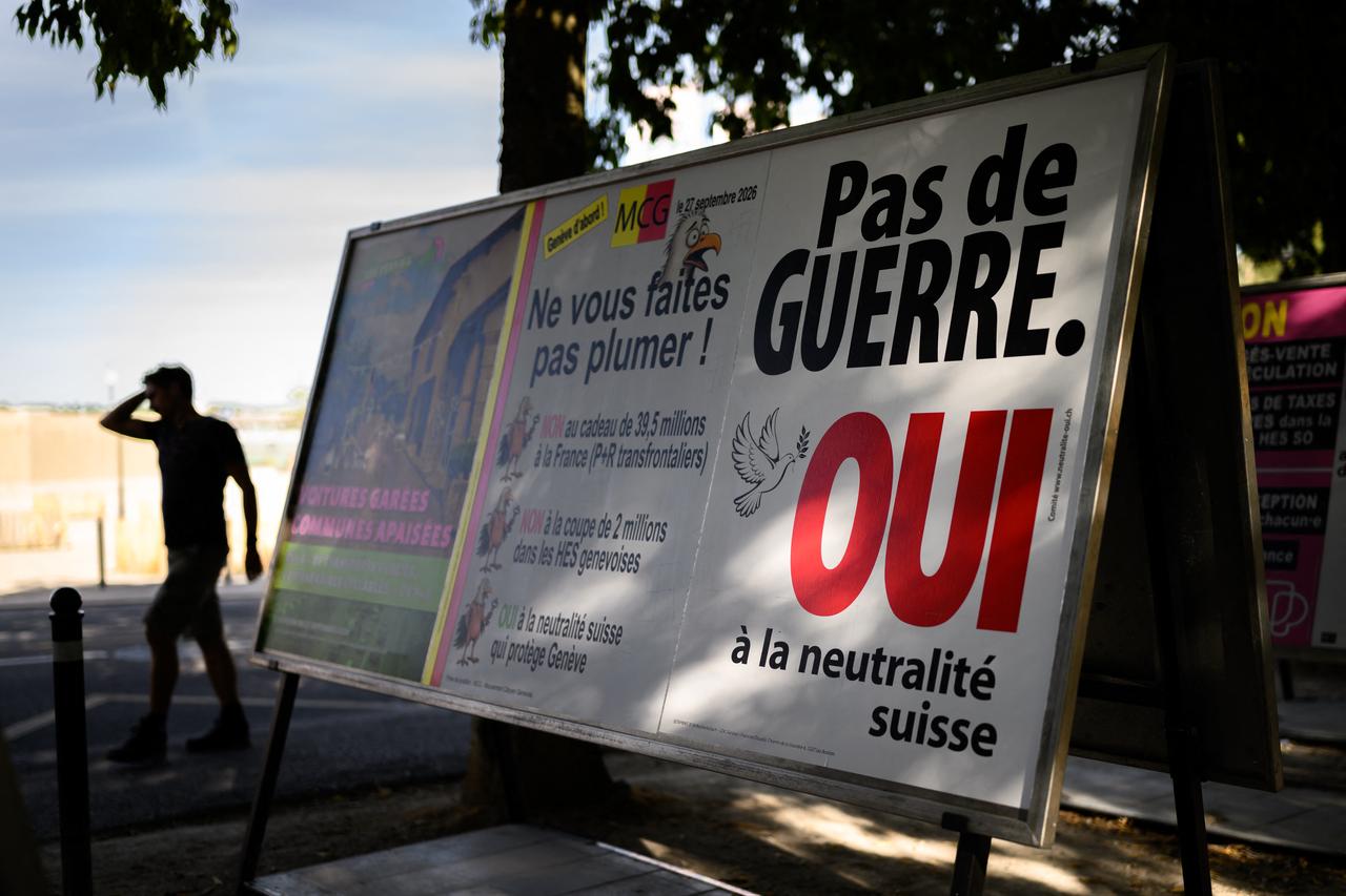 This photograph shows a campaign poster reading "No war, Yes to Swiss neutrality" on a street of Geneva, western Switzerland on September 21, 2026. (AFP Photo)