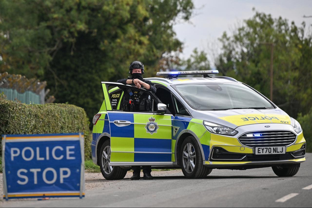 Armed police man a roadblock while posted at an entrance to RAF Fairford base in Fairford, south-west England on September 27, 2026. (AFP Photo)