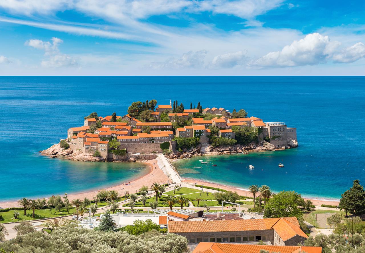 Sveti Stefan, a historic fortified islet and resort on Montenegro’s Adriatic coast, is seen from above near Budva. (Adobe Stock Photo)