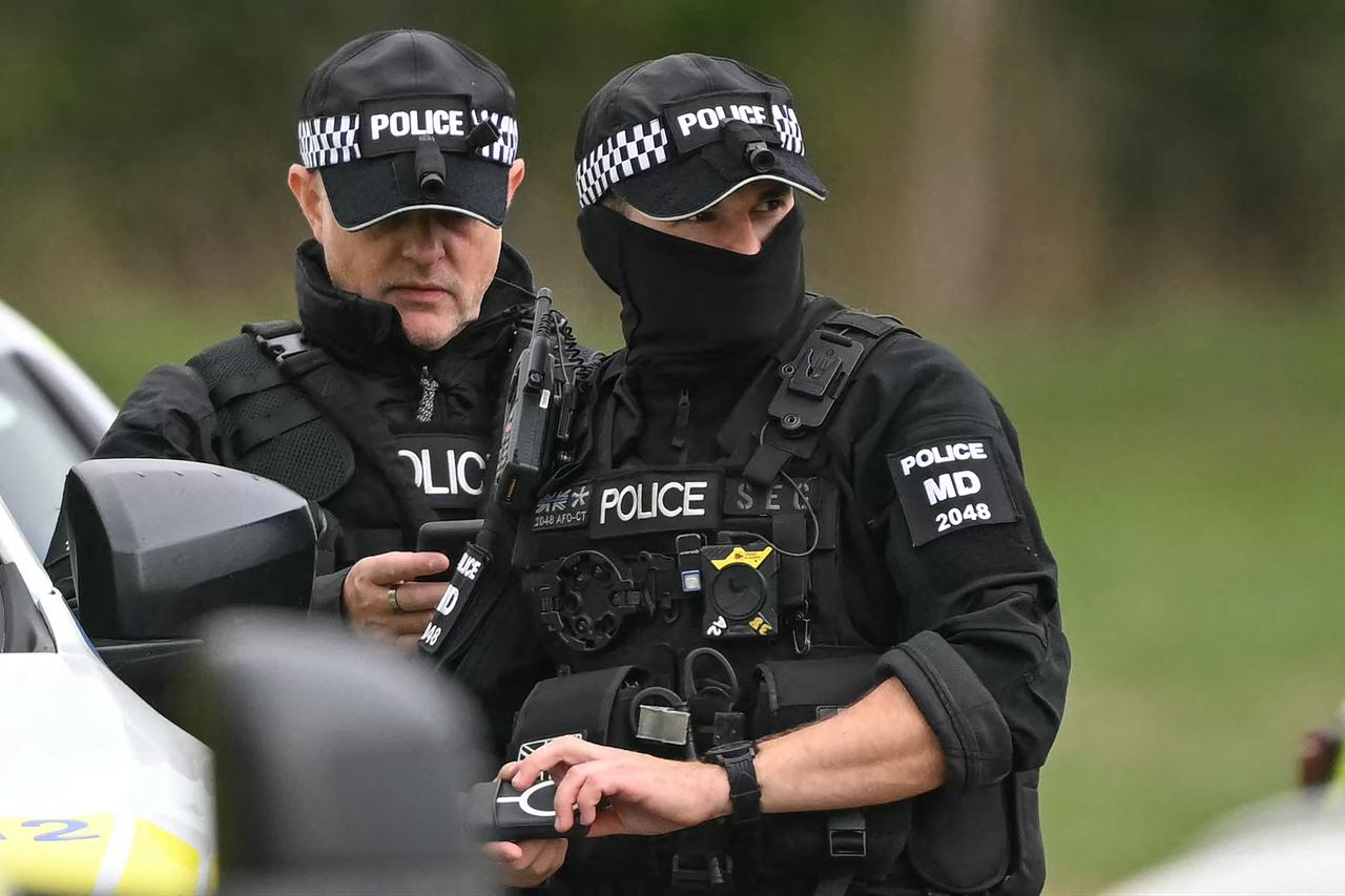 Police are pictured at a base set up at the Fairford Youth Football Club near RAF Fairford base, south-west England on September 27, 2026. (AFP Photo)
