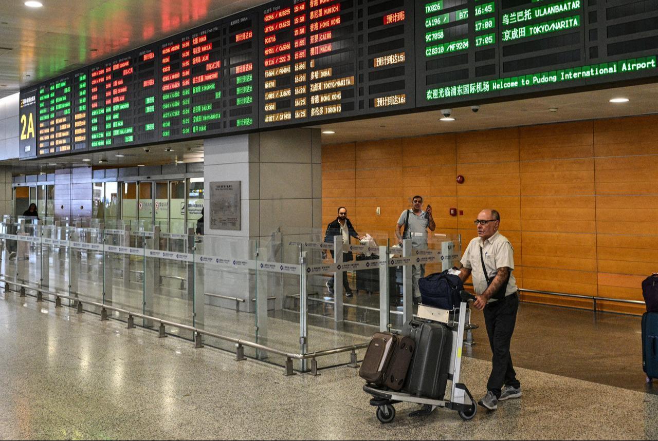 A man arriving from Tehran walks at Shanghai Pudong International Airport in Shanghai on September 24, 2026. (AFP Photo)