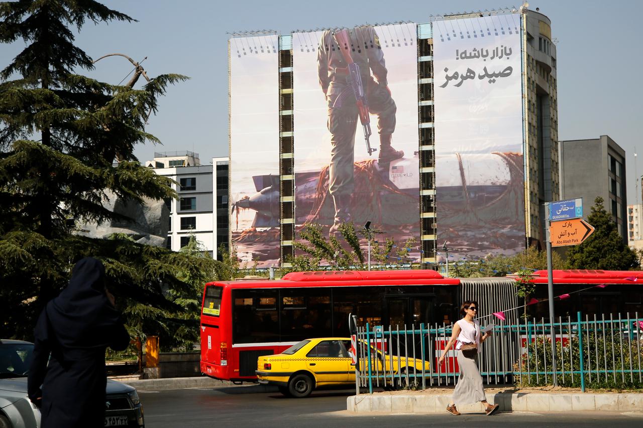 A large billboard depicting an armed member of Iran's Revolutionary Guard Corps (IRGC) standing with one foot on American REMUS 600 autonomous underwater vehicle (AUV) at Venek Square in central Tehran, Iran, on September 28, 2026. (AA Photo)