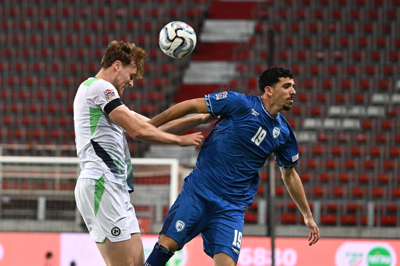 Ireland's midfielder #05 Jake O'Brien and Israel's defender #19 Dor Turgeman vie for the ball during the UEFA Nations League Group B3 between Israel and Republic of Ireland in Debrecen, Hungary on September 27, 2026. (AFP Photo)
