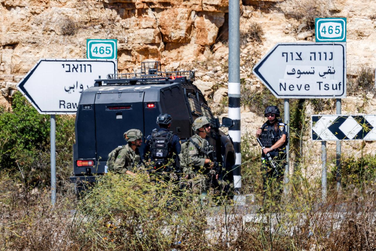 Israeli soldiers and police close the Atara checkpoint, north of Ramallah in the Israeli-occupied West Bank, and block the road leading to the Israeli settlement of Halamish on September 20, 2026. (AFP Photo)