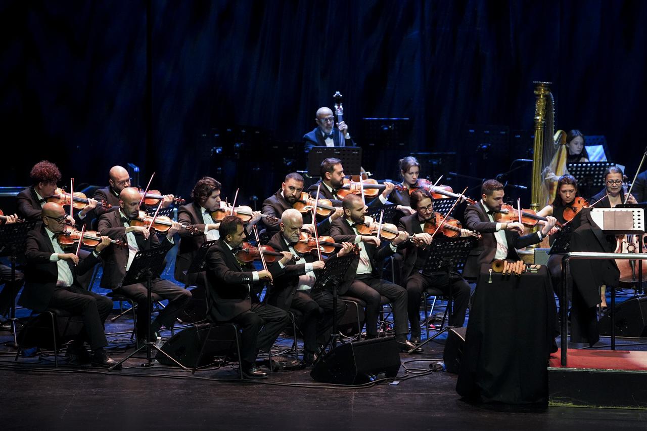 The National Arab Orchestra's string section performs onstage at the Ataturk Cultural Center during the Türkiye Culture Route Festival in Istanbul, Türkiye, Sept. 27, 2026. (AA Photo)
